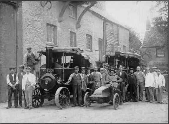 Old black and white photo from 1911 at Osney Mill of workers outside the mill